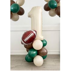 a balloon column with footballs and balloons