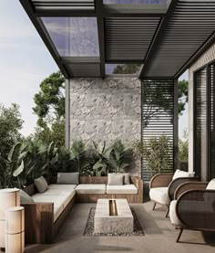 an outdoor living area with couches and tables