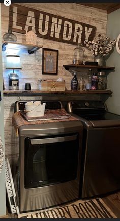 a washer and dryer in a room with wood paneling on the wall