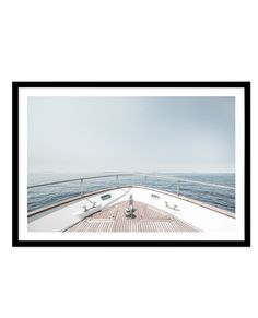 the back end of a boat with benches on it's deck and water in the background