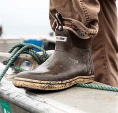 The Ankle Deck Boot collection has been crafted specifically for off-shore anglers. Anglers are athletes, and like any athlete, they demand the best footwear to help them perform at a high level. We've created a lightweight design with the same slip-resistant Chevron outsole found on our Legacy boots. The 6" ankle deck boot is a great option for any on-the-water athlete looking for protection with slip-on-and-go styling. This boot is constructed with hand-laid rubber, so not classified as a comm Deck Boots, Men Workwear, Fishing Boots, Durango Boots, Rocky Boots, Boot Collection, Twisted X Boots, Sas Shoes, Boy Outerwear