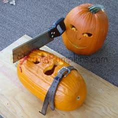 two pumpkins that have been carved to look like they are being cut with a knife