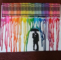 a couple under an umbrella painted with colored crayons