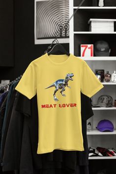 "T-Rex - Meat lover" design with chrome T-Rex This classic unisex jersey short sleeve tee fits like a well-loved favorite. Soft cotton and quality print make users fall in love with it over and over again. These t-shirts have-ribbed knit collars to bolster shaping. The shoulders are tapered for a better fit over time. Dual side seams hold the garment's shape for longer.  .: Made with 100% Airlume combed and ring-spun cotton, a lightweight fabric (4.2 oz/yd² (142 g/m that is easy to layer, breath Kids Tshirt Designs, Meat Lover, Dinosaur Print, T Rex, Leisure Wear, Dinosaurs, Jersey Shorts, Semi Formal, San Jose