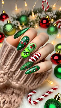 Get festive with these fun and vibrant Grinch-inspired Christmas nails! Featuring green Grinch faces, candy cane stripes, and glittery accents, these designs are perfect for spreading holiday cheer. Save this for your next holiday manicure! #Grinch #GrinchInspiredChristmasNail #GrinchInspiredNail Grinch Faces, Holiday Manicure, Candy Cane Stripes, Nails Design, Christmas Nails, Holiday Cheer