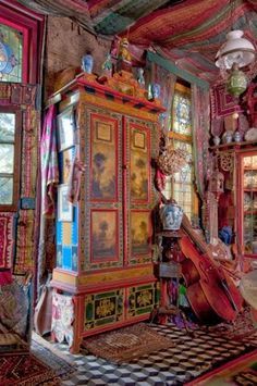 an elaborately decorated room with lots of colorful furniture and decor on the walls, floors, and ceiling