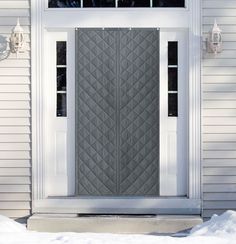 the front door of a house with snow on the ground