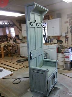 an old cabinet is being worked on in a garage