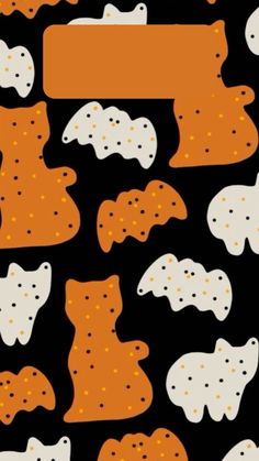 a black background with orange and white cat shapes on the bottom half of it's face