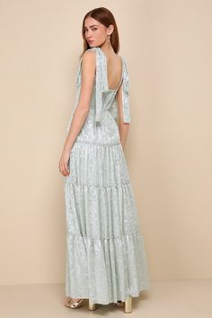 You'll stand out in everyone's memory with an adorable look like the Lulus Picturesque Allure Sage Green Jacquard Tie-Strap Maxi Dress! Lightweight woven fabric, with a shiny, burnout floral jacquard and striped pattern throughout, falls from tying straps into a flattering square neckline and a princess-seamed bodice. High, fitted waist sits atop a ruffled, tiered skirt that finishes at an elegant maxi hem. Smocked panel at back and hidden zipper/clasp. Fit: This garment fits true to size. Lengt Tiered Bridesmaid Dress, Country Wedding Guest Dress, Fall Formal Dresses, Smock Dress Outfit, Sage Green Dress, Vegas Dresses, Derby Dress, Rush Dresses, Homecoming Dresses Long