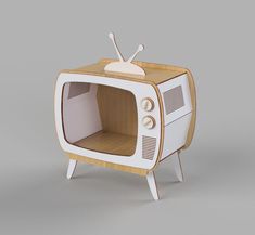 an old fashioned television with a wooden stand on it's legs and the tv is turned upside down