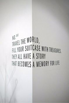 there is a quote on the wall that says no travel the world, fill your suitcase with treasures they all have a story that becomes a memory for life