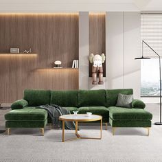 a living room with a green couch and chair