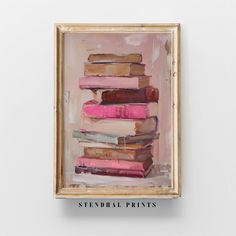 a painting with books on top of it in a wooden frame hanging on the wall