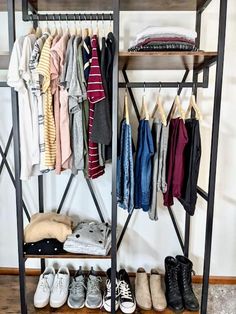 a rack with shoes and clothes hanging on it