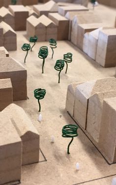 small green plants growing out of concrete blocks