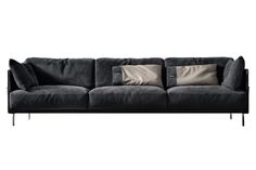 a black couch with two pillows on it