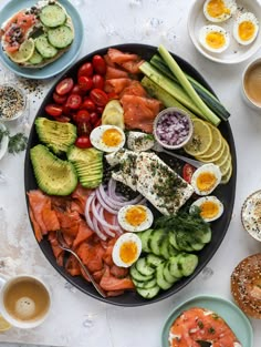 a platter filled with different types of vegetables and eggs on top of a table