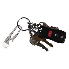 a bunch of keys that are laying on top of each other in the shape of a keychain