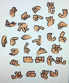 the letters are drawn with brown paint on white paper and placed in different shapes, sizes, and colors