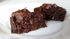 two pieces of chocolate cake on a white plate