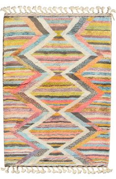 a multicolored rug with fringes on it