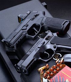 two handguns and ammols are on display