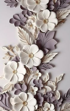 paper flowers are arranged on the wall in this artistic art work, which looks like they have