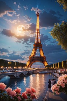 the eiffel tower lit up at night with pink flowers in front of it