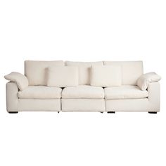 a white couch with pillows on it