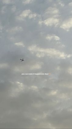 an airplane is flying high in the sky on a cloudy day with words written below it