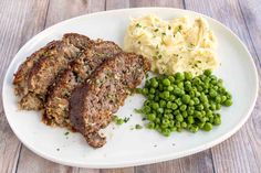 meatloaf, mashed potatoes and peas on a plate