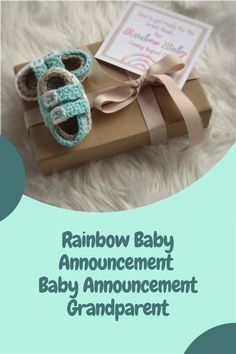 a baby's first year announcement is shown with a pair of shoes on top of a gift box