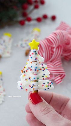 there is a small christmas tree made out of icing and sprinkles