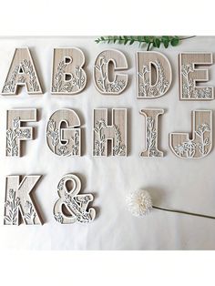 wooden letters and numbers are displayed on a table