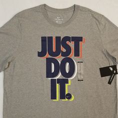 Brand New With Tags Attached Men's Size Xxl Nike "Just Do It" T-Shirt. Please See All Attached Pictures For Any Additional Details. Nike Gray T-shirt With Logo Print, Nike Gray Crew Neck Shirt, Nike Gray Short Sleeve Shirt, Nike T-shirt In Athletic Heather With Logo Print, Nike Athletic Heather T-shirt With Logo, Nike Graphic Print T-shirt In Athletic Heather, Georgia Shirt, Navy Blue Shirts, Nike Air Force Ones