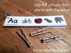 a bookmark with scissors, an apple and other items on it that say clip the picture that starts with the letter aa