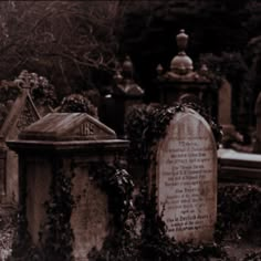 an old cemetery with tombstones covered in ivy