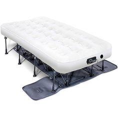 an inflatable mattress is sitting on top of a snowboard with two legs