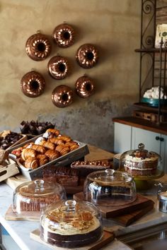 a table topped with lots of different types of pastries and desserts on top of it