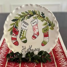 a plate with stockings and holly on it