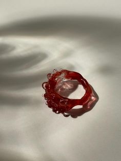 One-of-a-kind unique chunky handmade borosilicate glass ring in a beautiful translucent red and rose glass.  Hi, nice to digitally meet you :) My name is Maureen I am a 20-something jewellery artist with a specialisation in glass jewellery located in the Netherlands. The ring you are currently looking at is formed using a technique called lampworking. It is made from borosilicate glass also called medical-grade glass as it is the sturdiest kind of glass.  Each jewel is unique as I handcraft ever Glass Jewellery, Glass Ring, Glass Rings, Artistic Jewelry, Red Glass, Handmade Artisan, Glass Jewelry, Rings Statement, The Netherlands