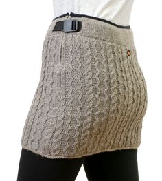 This soft hand-knit New Zealand wool miniskirt sports a classic cable-knit design, and is fleece lined for ultimate comfort. The wool fabric is the perfect weight for spring, summer and fall, and can even be worn with tights for the winter months. Find out for yourself why this classic skirt is so popular! Classic Skirts, Soft Hands, Knit Skirt, Winter Months, Soft Hand, Wool Fabric, Winter Wear, Knitting Designs, The Winter