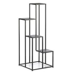 three black metal shelves with one shelf on each side and the other in the middle