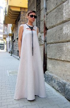 "Stylish and elegant long linen dress. Zip fastening. Elastic band on the back. This incredible dress will highlight your femininity! Suitable for any occasion. Some of the linen fabrics are mixed with cotton or viscose. You will find more information in the color chart HEIGHT OF MODEL: 168 cm. / 5′ 6″ Size S All garments are handmade. Please provide your PHONE NUMBER for delivery ALL ORDERS ARE SHIPPED VIA DHL If you have different measurements please inform us. SIZE CHART (measurements of the Luxury Cotton Evening Dress, Beige Linen A-line Maxi Dress, Beige A-line Linen Maxi Dress, Elegant Sleeveless Linen Dress, Elegant Flax Linen Dress, Sleeveless Beige Linen Maxi Dress, Women Maxi Dresses Summer, Linen Kaftan, Natural Linen Dress