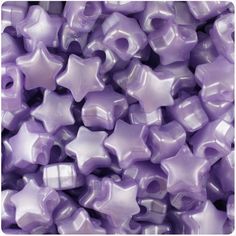 purple star shaped beads are stacked together