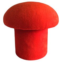 a large red mushroom shaped object on a white background