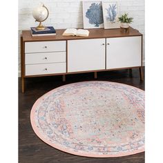 a round rug on top of a wooden table