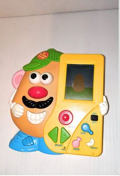 a toy cell phone with an image of a cartoon character on the front and side