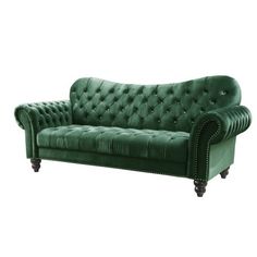 a green couch sitting on top of a wooden floor